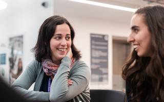 Two female researchers in conversation