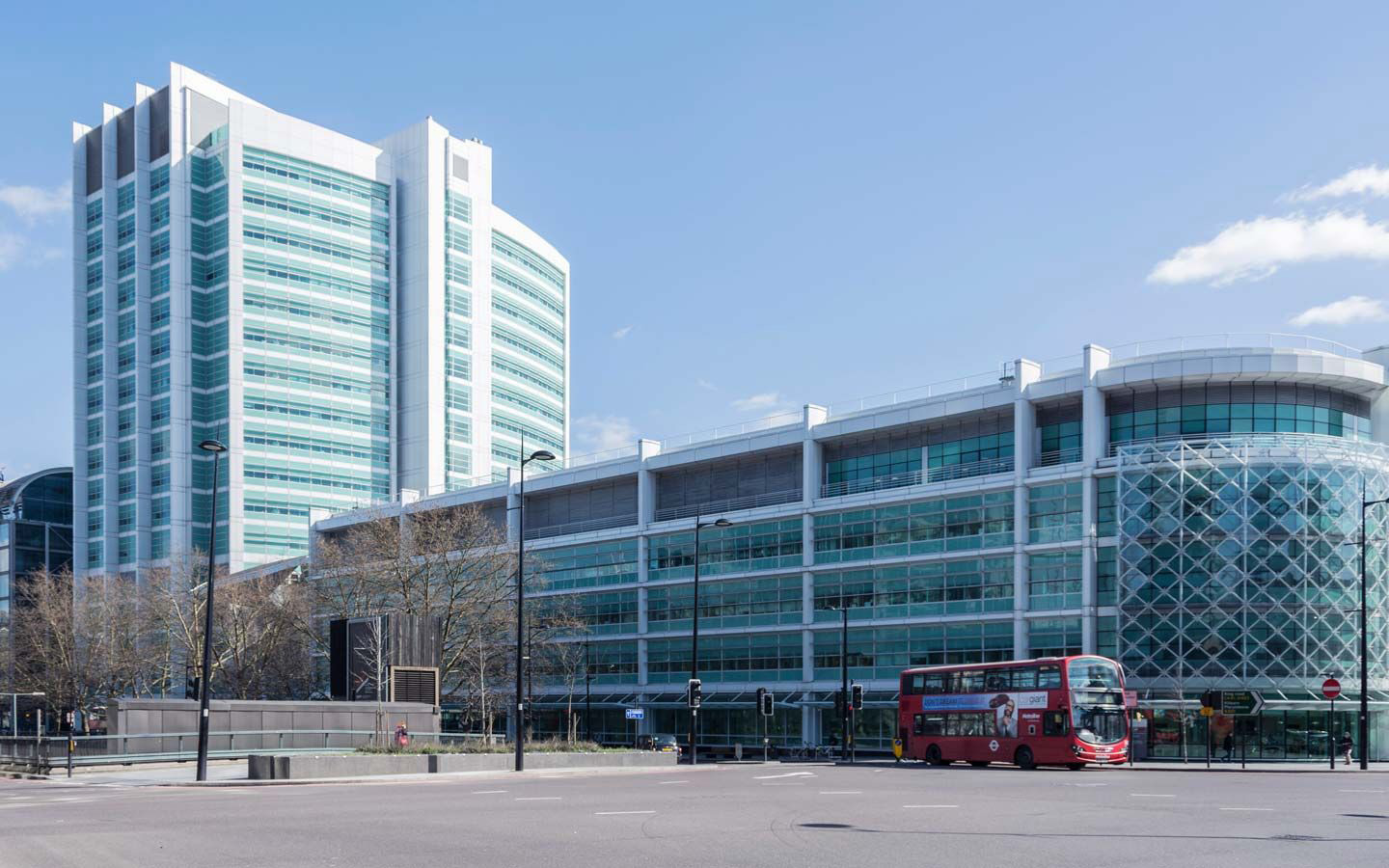 external picture of University College Hospital with a red double decker bus 