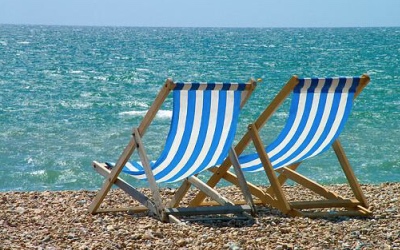 Image of deckchairs on a beach