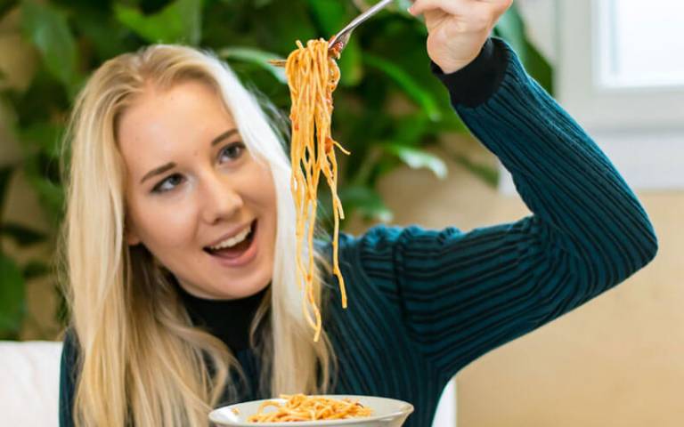 Qualified Nutritionist Pixie Turner with a bowl of spaghetti