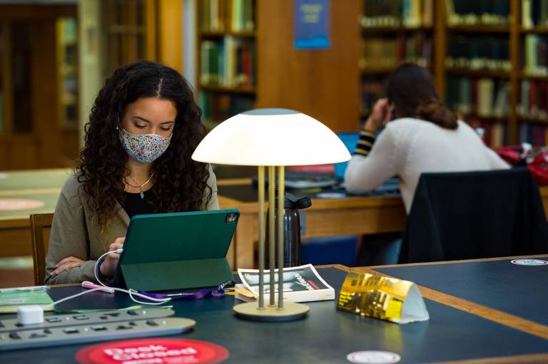 Student studying in UCL library