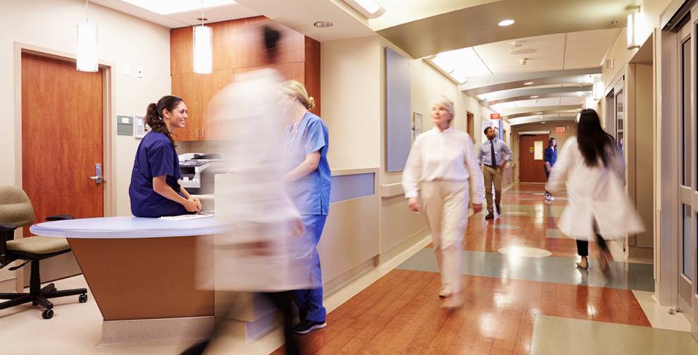 Healthcare professionals walking in a clinical setting