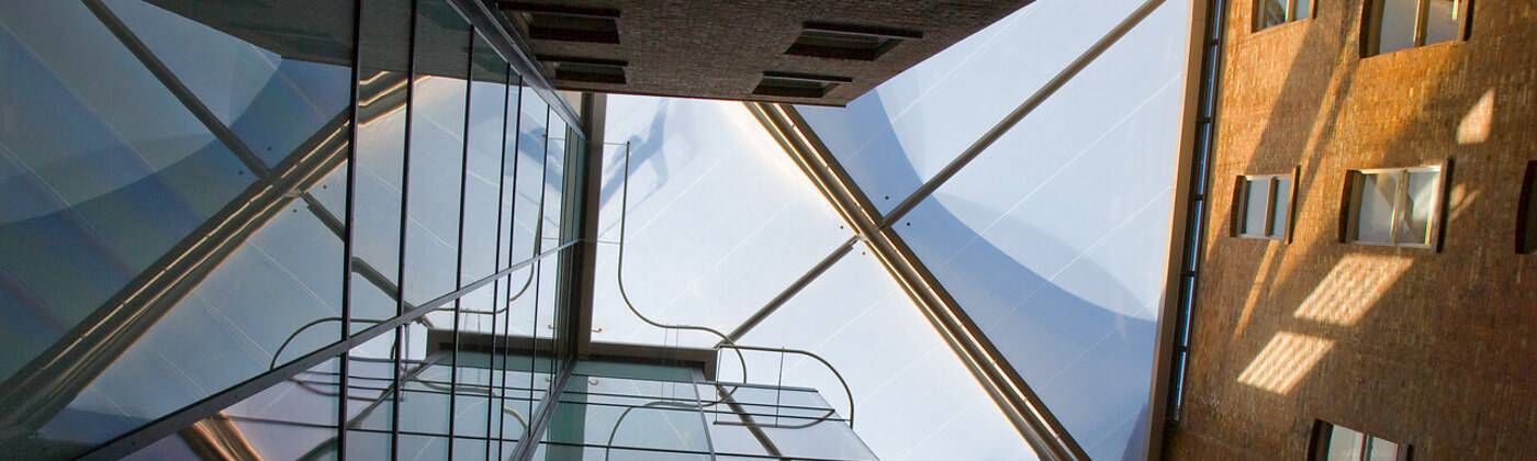 Skyward image of the glass framework, Paul O'Gorman Building, UCL