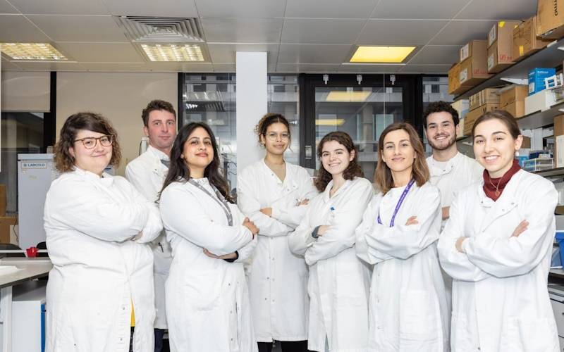 Pereira / Acedo group picture in lab coats 