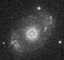 Square Patterning around the bright centre of a galaxy caused by coincidence loss