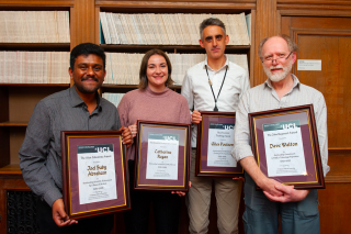 Showing the four winners of the Space & Climate Physics awards holding their certificates