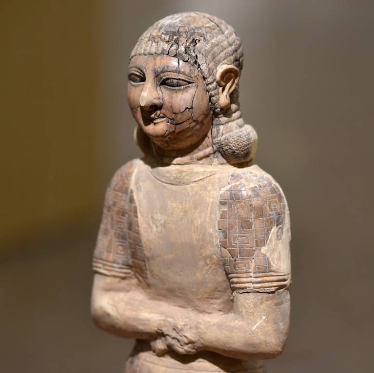Ivory statuette of a beardless Assyrian man