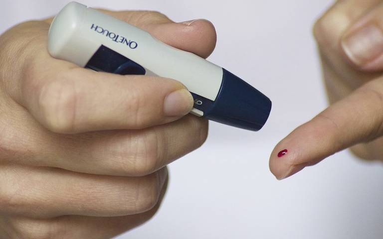 a person testing their blood sugar levels