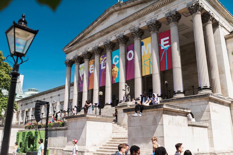 The portico of the UCL Wilkins Building bearing a sign saying 'Welcome'