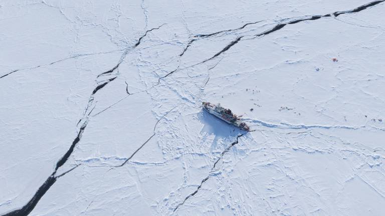 The research vessel Polarstern drifting in ice in the Arctic Ocean. 