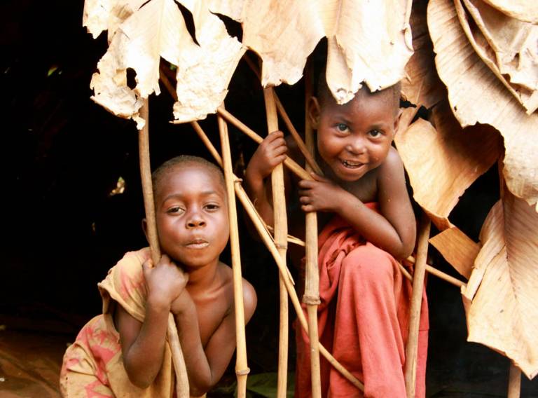 BaYaka children in their hut