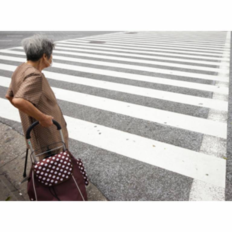 Older person crossing the road