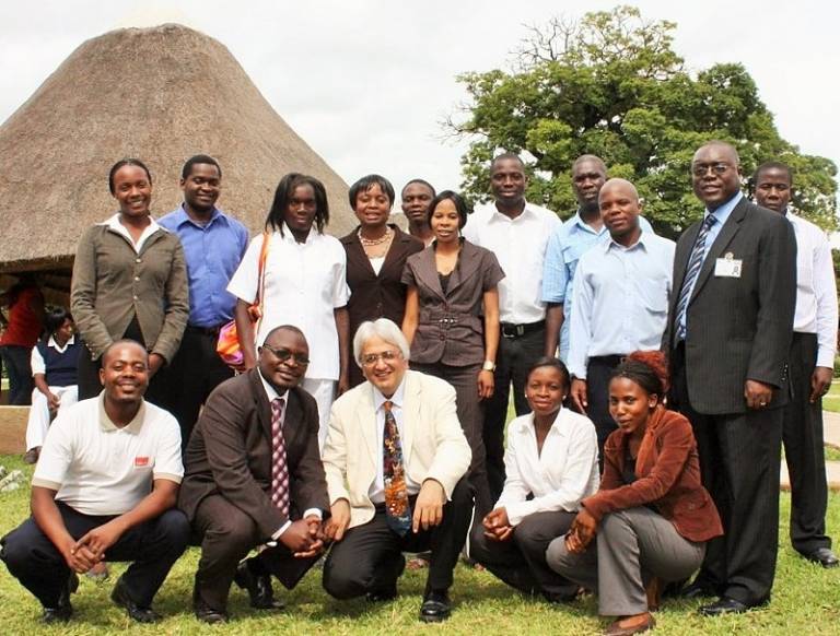 Professor Alimuddin Zumla (centre) with the Zambia research staff