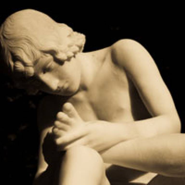 Marble statue of Achilles taking a closer look at his injured heel
