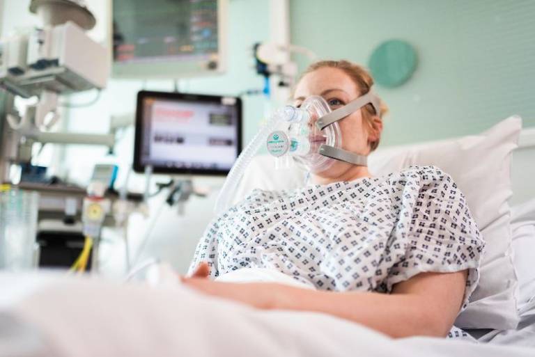Female patient wearing a CPAP breathing device
