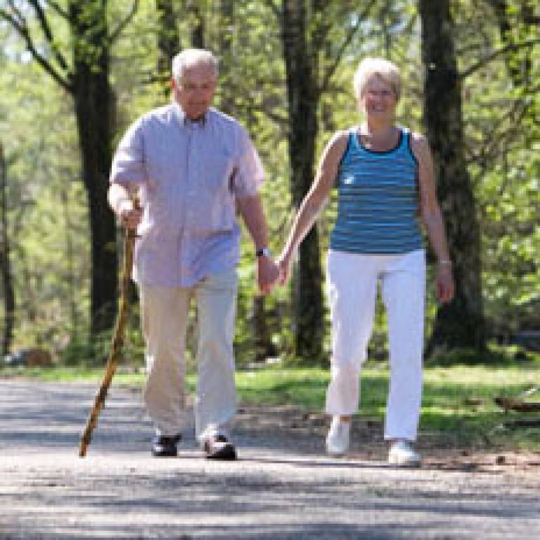 An elderly couple out walking