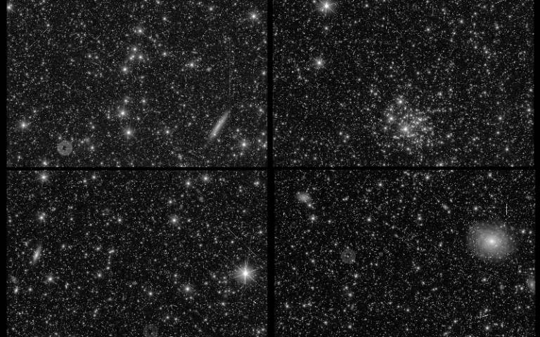 A starfield with some visible galaxies and small streaks across the image.
