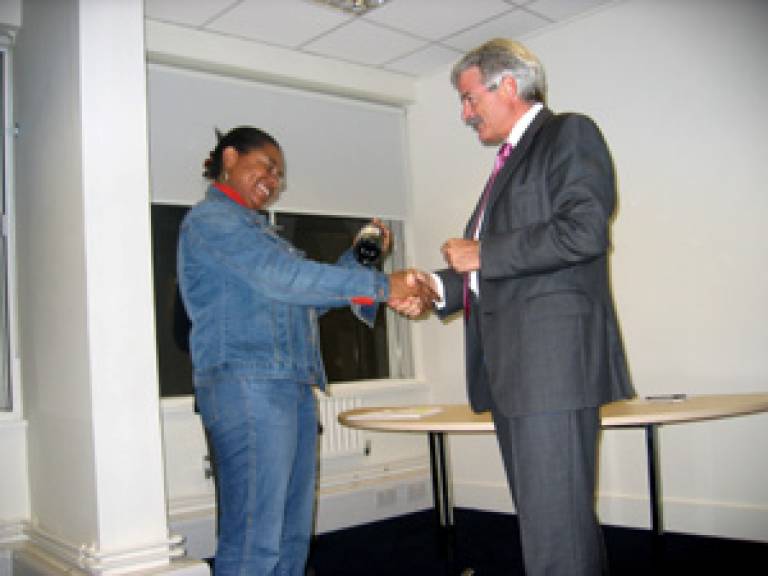Professor Grant awarding a prize to Daliah Haughton