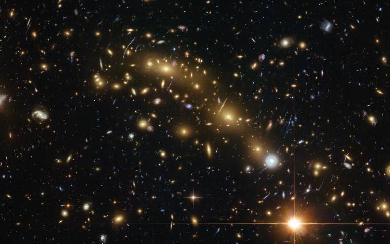 A colour image of the galaxy cluster used to detect one of the six galaxies, MACS0416-JD, currently the most distant galaxy detected with ALMA