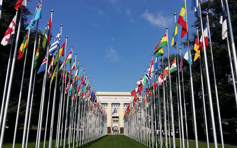 An image of flags outside UN HQ in Geneva 