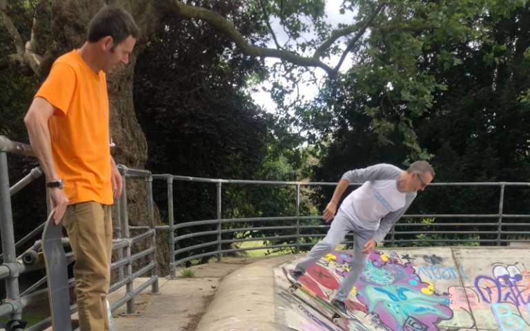 Prof Iain Borden and Dr Patrick Quinn ride skateboards at a skatepark in Kennington.