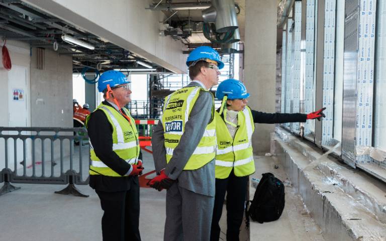 Left to right: Prof Alan Thompson, Stephen Timms MP for East Ham, Prof Paola Lettieri on an upper level of the Marshgate construction site at the UCL East campus looking out across the Queen Elizabeth Olympic Park