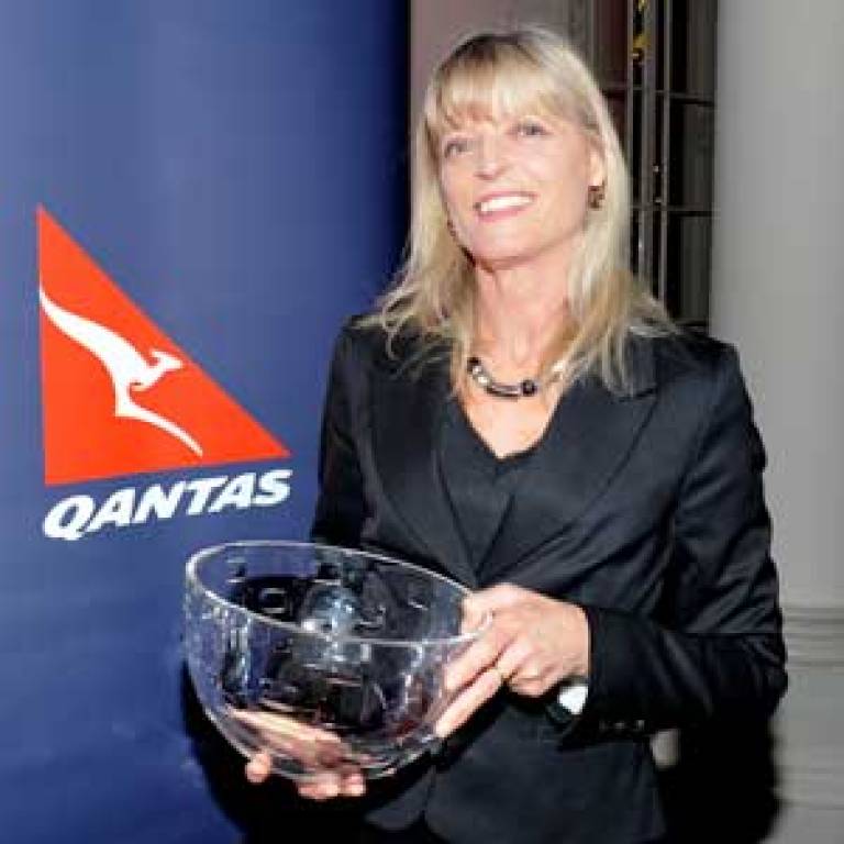 Dr Margaret Mayston with her award from Quantas