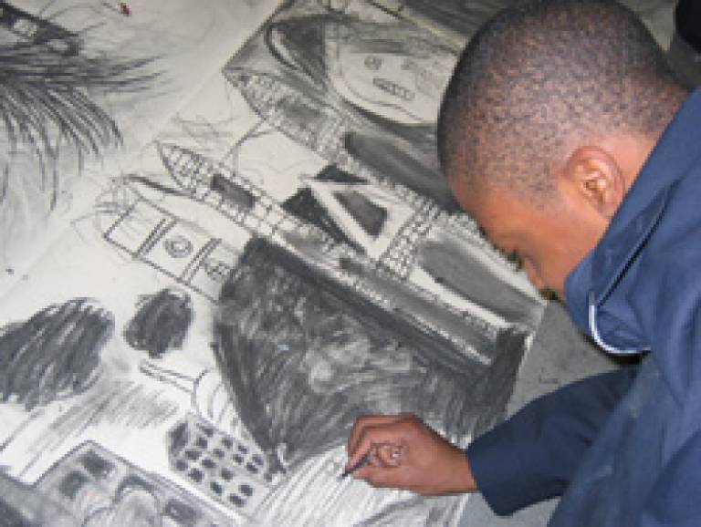 A Capital City Academy student prepares for the Metropolis exhibition
