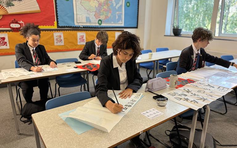 Pupils in London practising Chinese calligraphy