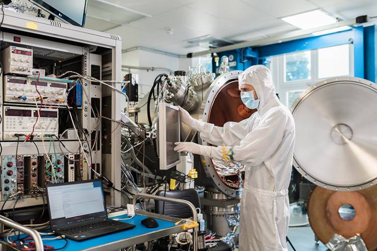 an engineer in a clean room at MSSL testing an instrument that will go on the Vigil space weather satellite