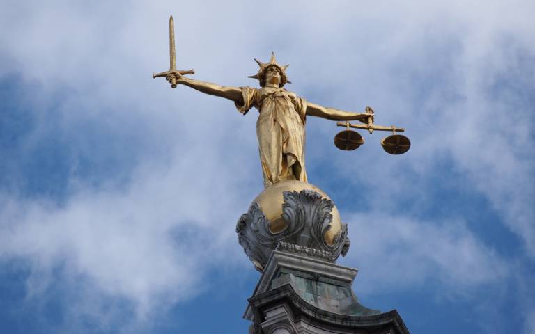Statue of justice on top of the Old Bailey criminal court in London. Credit: iStock