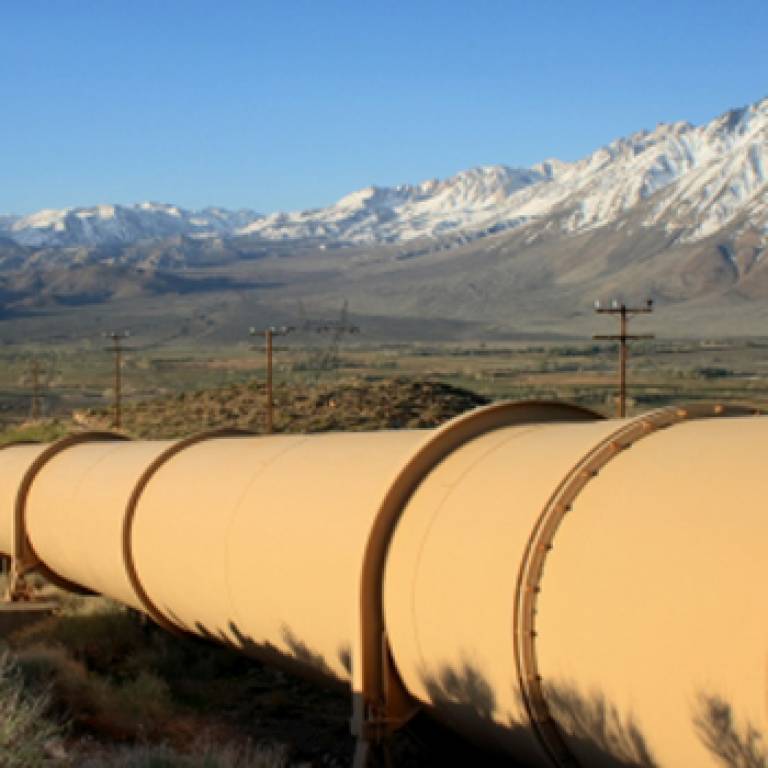 Oil pipeline heading into the mountains