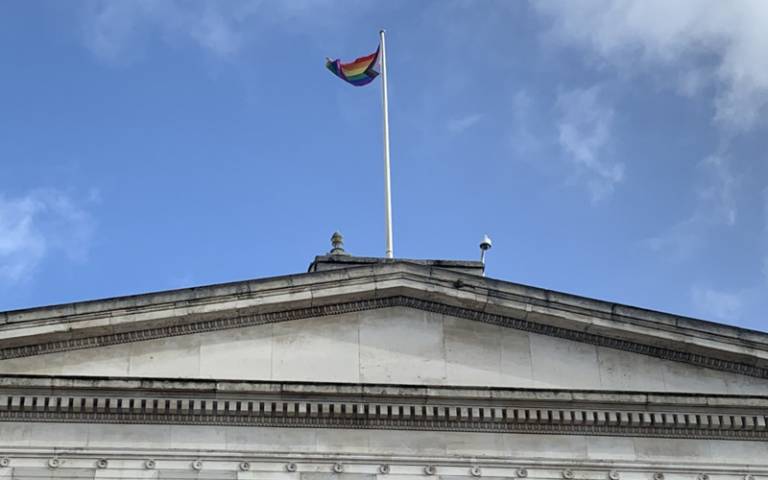 The Progress Pride flag on UCL's Portico during LGBT+ History Month 2022