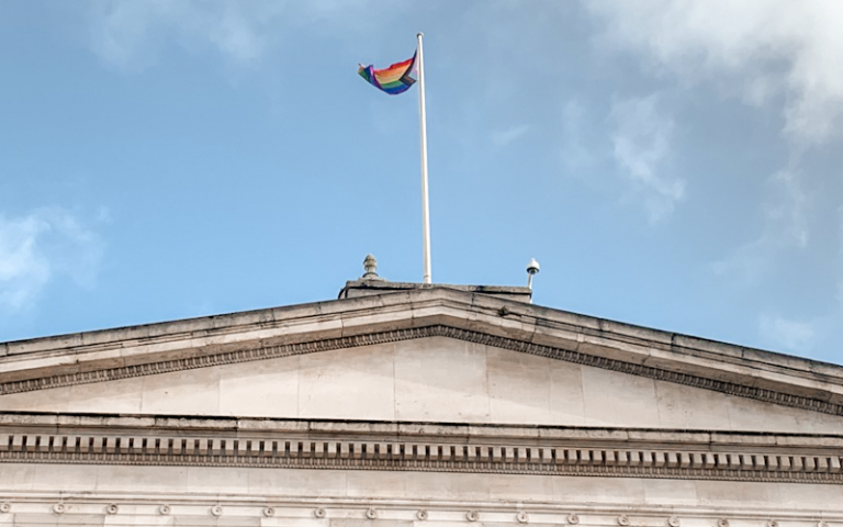 The pride flag on the UCL portico building