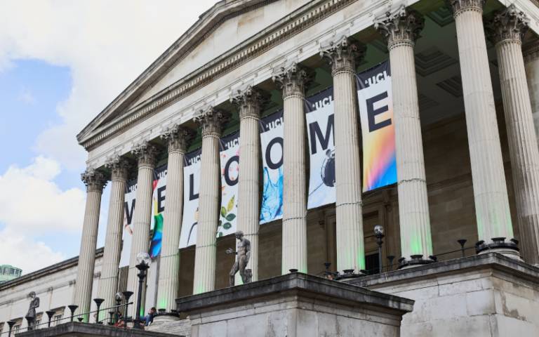 The UCL Portico building, displaying large banners reading 'Welcome'
