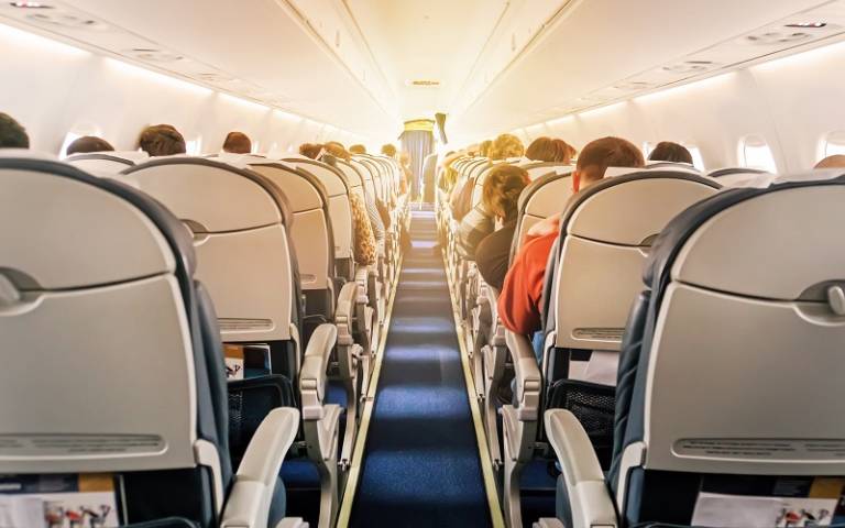 Image shows passengers on an aeroplane