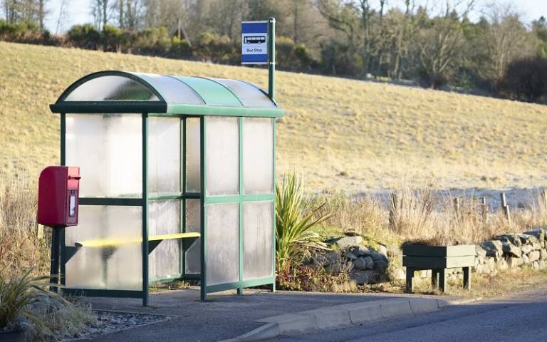 Image shows a rural bus stop