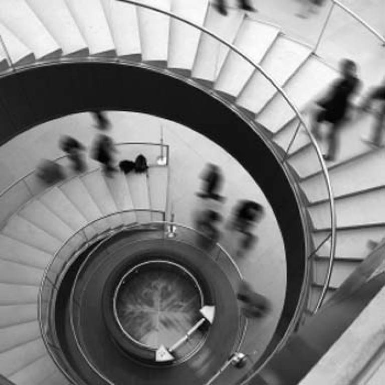 Office workers on a spiral staircase