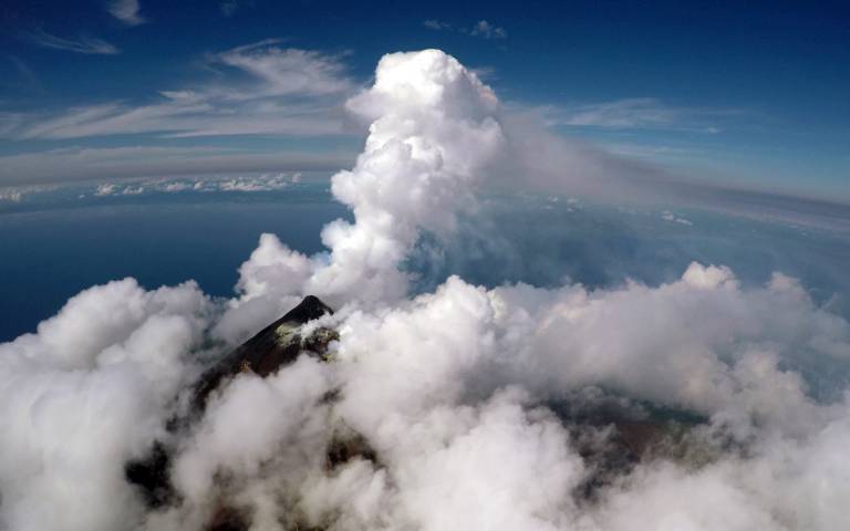 Aerial view of the active vent and gas plume of Manam volcano, Papua New Guinea, from a fixed-wing drone at 2300 m altitude.