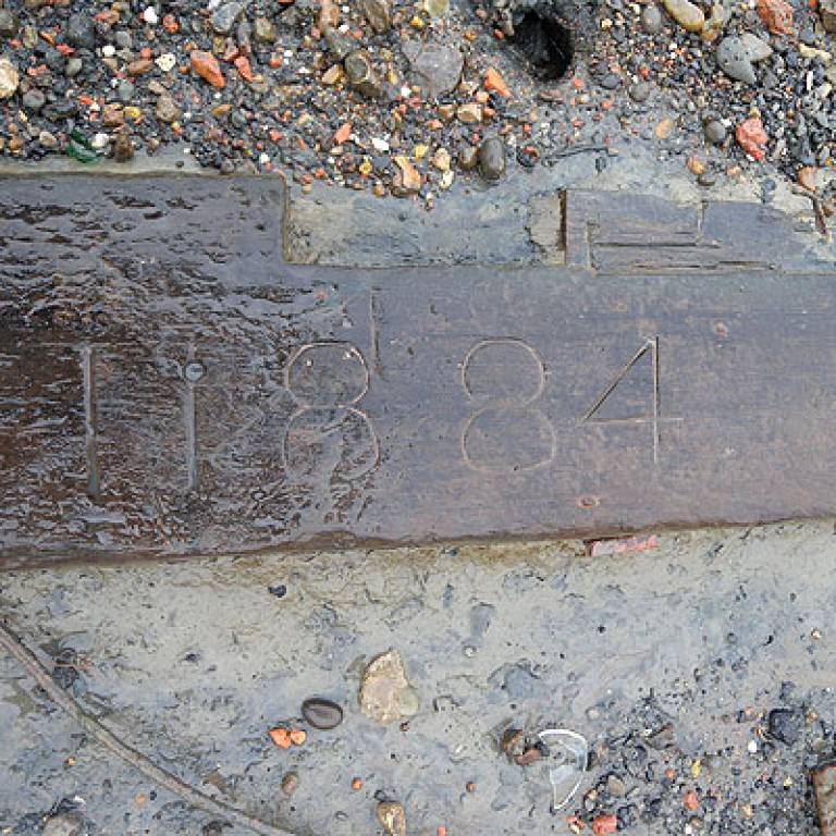 Inscribed timber on the Thames foreshore