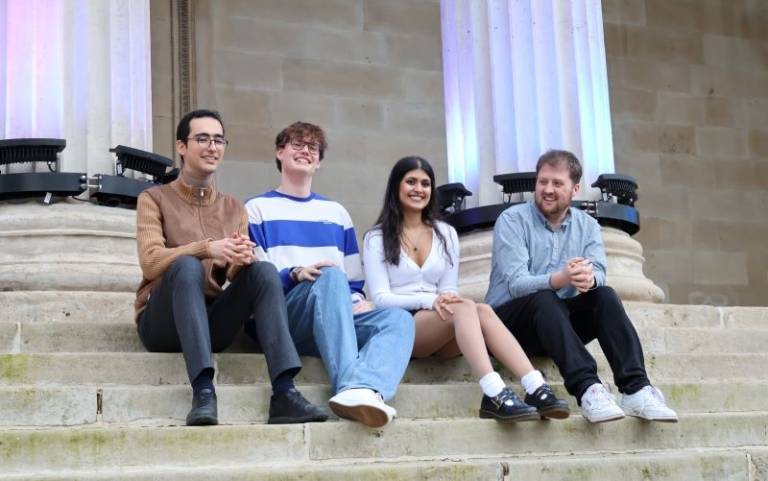 The University Challenge finalists sitting on the main quad.