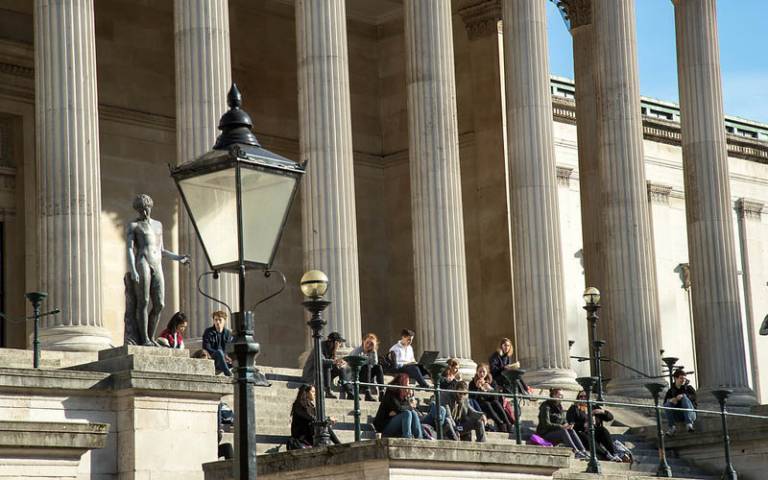 Students sitting on the Portico Steps