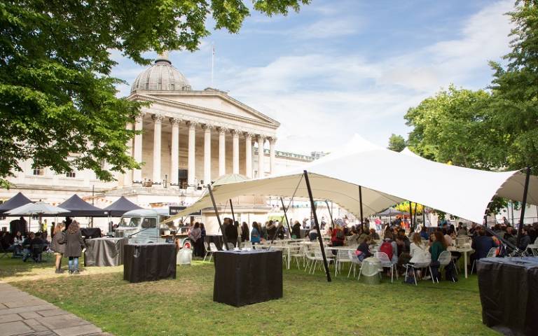 UCL's 2022 summer celebration, with people sitting in the Cafe on the Quad