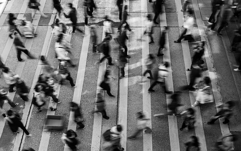 an image of people crossing a Zebra Crossing 
