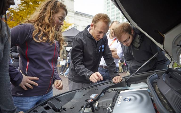Dr Michael Whiteley shows PhD students the Toyota Mirai's fuel cell