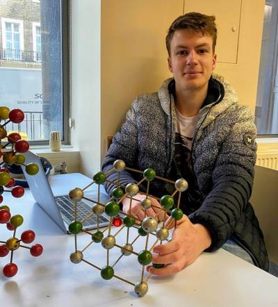 UCL & Imperial College researcher Seán Kavanagh with an atomic model of the nanocrystal structure