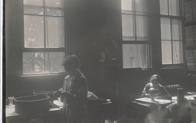 archive black and white photograph of women working in Galton lab, possibly early 20th century