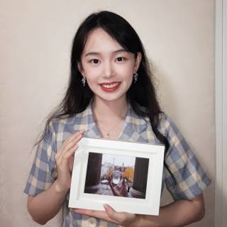 #loveUCL 2019-20 Photo of the Year winner, Bartlett graduate Runsu holding her winning photo