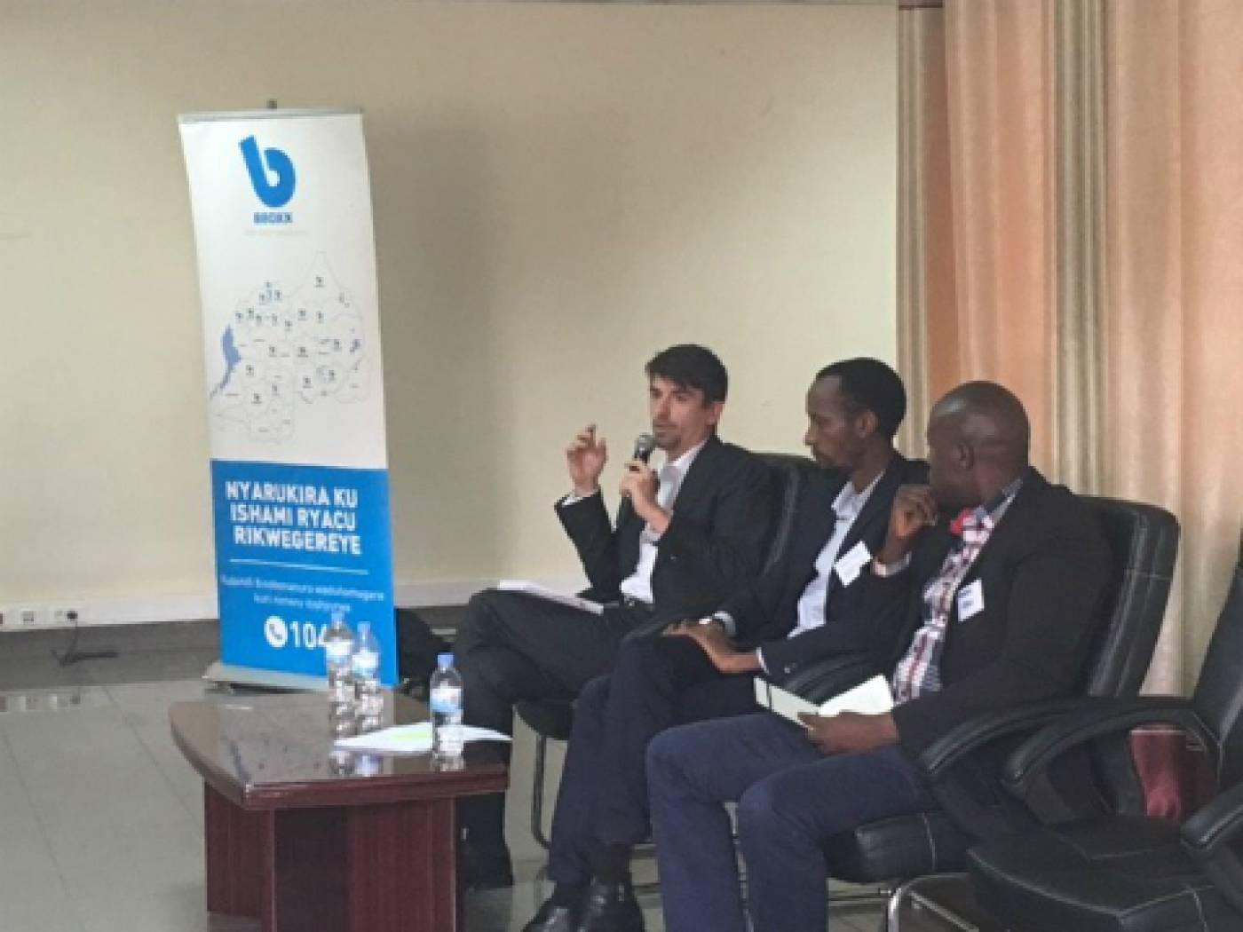 Simon Rolland (EnDev), Justus Mucyo (BBOXX) and Morris Kayitare (EDCL), answer questions from the audience.