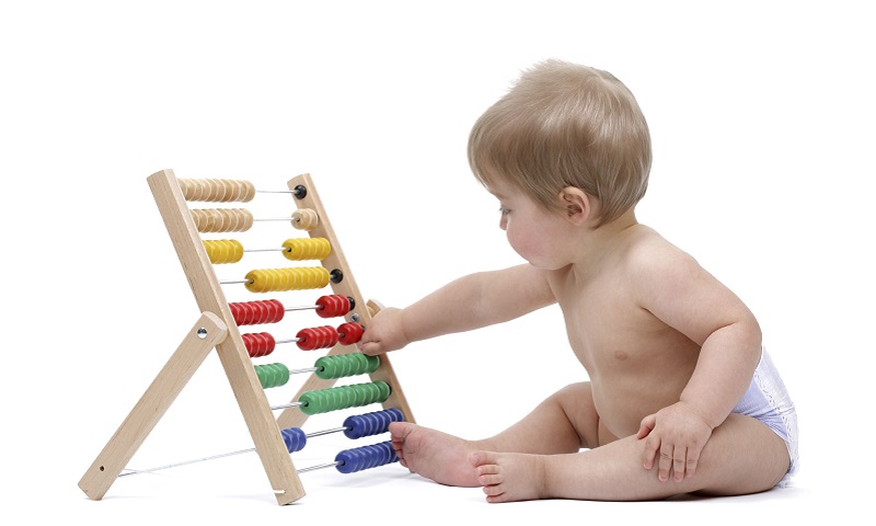 baby playing with an abacus